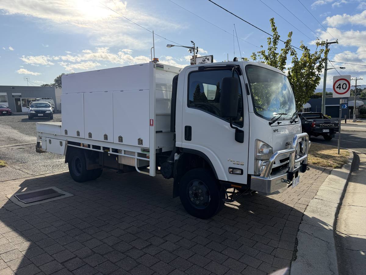 White Isuzu NPS 75-155 4x4 truck with service body, sold by Streets Automotives in Deloraine